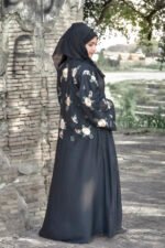 Front Open Abaya in Black Color which is crafted with premium Nida Korean fabric featuring the embroidery on sleeves and backside as well as a matching scarf in chiffon fabric.