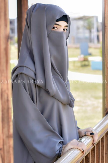 Grey Colored Maxi Abaya in Nida Korean Fabric featuring the elastic sleeves cuffs and a matching scarf in chiffon fabric.