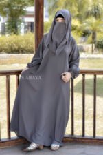 Grey Colored Maxi Abaya in Nida Korean Fabric featuring the elastic sleeves cuffs and a matching scarf in chiffon fabric.