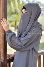 Grey Colored Maxi Abaya in Nida Korean Fabric featuring the elastic sleeves cuffs and a matching scarf in chiffon fabric.