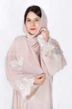 Front Open Abaya in Peach Color is crafted in Premium Nida Korean Fabric featuring the embroidery at all around bottom, sleeves and motif on the scarf in same embroidery pattern which is in chiffon fabric