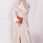 Front Open Abaya in Peach Color is crafted with premium Nida Korean Fabric featuring the embroidery at all around bottom, sleeves and motif on the scarf in same embroidery pattern which is in chiffon fabric.