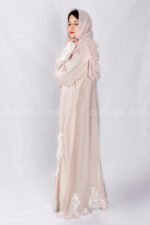 Front Open Abaya in peach color is crafted with premium Nida Korean Fabric featuring the stylish embroidery at all around bottom, sleeves and motif on the scarf in same embroidery pattern which is in chiffon fabric.