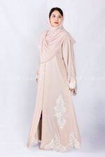 Front Open Abaya in Peach Color is crafted in Premium Nida Korean Fabric featuring the elegant embroidery at all around bottom, sleeves and motif on the scarf which is in chiffon fabric.