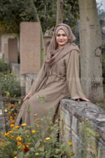 Front Open Abaya in Skin Color which is crafted in premium nida korean fabric featuring the button style on front stretchy elastic and plates style as well as a matching scarf in chiffon fabric.