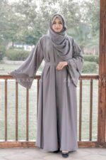 Front Open Abaya which is crafted in Nida Korean Fabric featuring the dual layer sleeves and pearl work on it as well as on scarf which is in chiffon fabric.