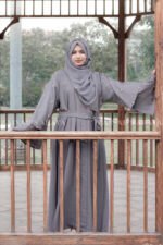 Front Open Abaya which is crafted in Nida Korean Fabric featuring the dual layer sleeves and pearl work on it as well as on scarf which is in chiffon fabric.