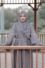 Front Open Abaya which is crafted in Nida Korean Fabric featuring the dual layer sleeves and pearl work on it as well as on scarf which is in chiffon fabric.