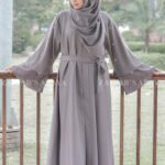Front Open Abaya which is crafted in Nida Korean Fabric featuring the dual layer sleeves and pearl work on it as well as on scarf which is in chiffon fabric.