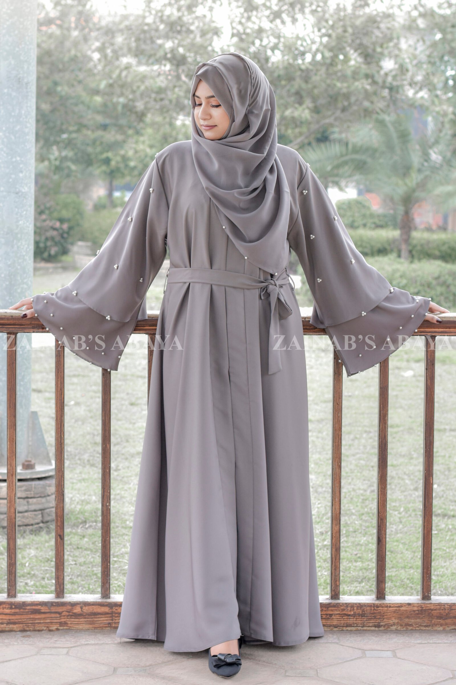 Front Open Abaya - Zainab Designer Abaya Front Open Abaya which is crafted in Nida Korean Fabric featuring the dual layer sleeves and pearl work on it as well as on scarf which is in chiffon fabric.
