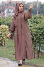 Maxi Abaya in Nida Korean Fabric featuring the plates on front upper button style at one side and cuff sleeves as well as a matching scarf in chiffon fabric.