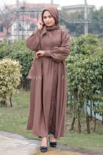 Maxi Abaya in Nida Korean Fabric featuring the plates on front upper button style at one side and cuff sleeves as well as a matching scarf in chiffon fabric.
