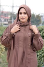 Maxi Abaya in Nida Korean Fabric featuring the plates on front upper button style at one side and cuff sleeves as well as a matching scarf in chiffon fabric.