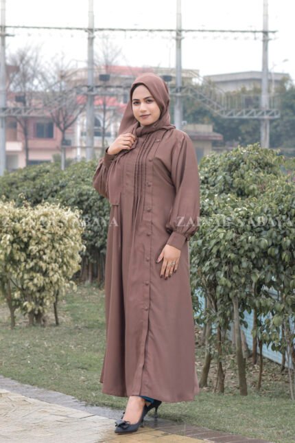 Maxi Abaya in Nida Korean Fabric featuring the plates on front upper button style at one side and cuff sleeves as well as a matching scarf in chiffon fabric.