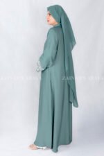 Nida Front Open Double Gown Abaya in Grape Color which is crafted in Premium Nida Korean Fabric featuring the stylish embroidery and button style on front and sleeves as well as a matching scarf in chiffon fabric with a same embroidery pattern motif .