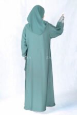 Nida Front Open Double Gown Abaya in Grape Color which is crafted in Premium Nida Korean Fabric featuring the stylish embroidery and button style on front and sleeves as well as a matching scarf in chiffon fabric with a same embroidery pattern motif .