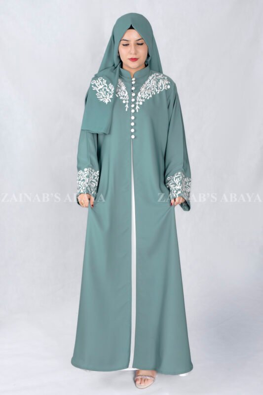 Nida Front Open Double Gown Abaya in Grape Color which is crafted in Premium Nida Korean Fabric featuring the stylish embroidery and button style on front and sleeves as well as a matching scarf in chiffon fabric with a same embroidery pattern motif .