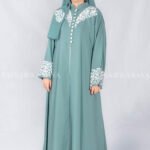 Nida Front Open Double Gown Abaya in Grape Color which is crafted in Premium Nida Korean Fabric featuring the stylish embroidery and button style on front and sleeves as well as a matching scarf in chiffon fabric with a same embroidery pattern motif .