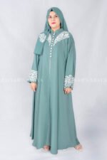Nida Front Open Double Gown Abaya in Grape Color which is crafted in Premium Nida Korean Fabric featuring the stylish embroidery and button style on front and sleeves as well as a matching scarf in chiffon fabric with a same embroidery pattern motif .