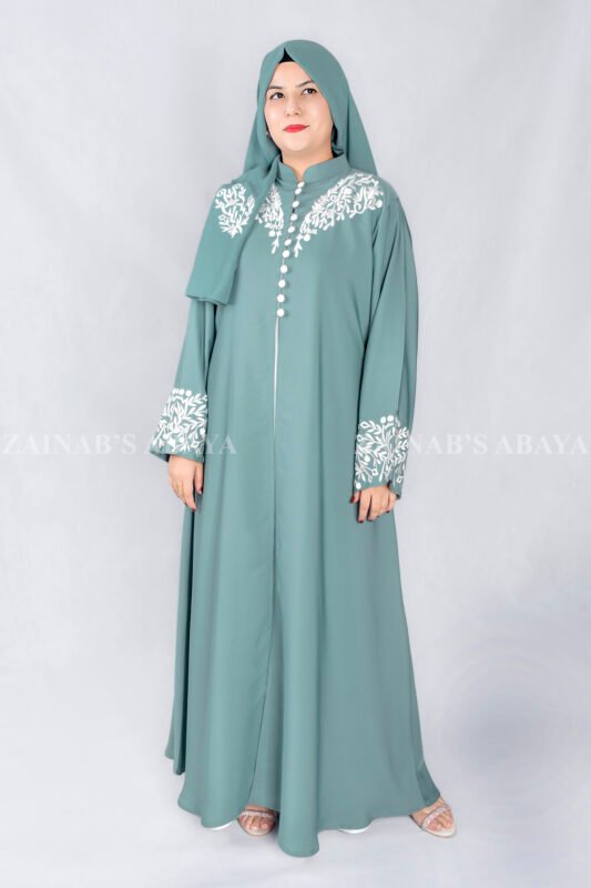 Nida Front Open Double Gown Abaya in Grape Color which is crafted in Premium Nida Korean Fabric featuring the stylish embroidery and button style on front and sleeves as well as a matching scarf in chiffon fabric with a same embroidery pattern motif .
