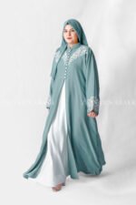 Nida Front Open Double Gown Abaya in Grape Color which is crafted in Premium Nida Korean Fabric featuring the stylish embroidery and button style on front and sleeves as well as a matching scarf in chiffon fabric with a same embroidery pattern motif .