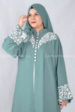 Nida Front Open Double Gown Abaya in Grape Color featuring the stylish embroidery and button style on front and sleeves as well as a motif in same embroidery pattern on scarf which is in chiffon fabric.