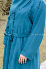 Front Open Abaya in Nida Korean Fabric in Zinc Color featuring button down style, two side pockets, an adjustable belt or a matching scarf in chiffon fabric.