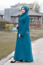 Front Open Abaya in Nida Korean Fabric in Zinc Color featuring the button down style at front, two side pockets, an adjustable belt, or a matching scarf in chiffon fabric.