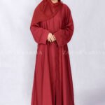 Red Colored Front Open Abaya is crafted with Premium Nida Korean Fabric with two side left right pockets as well as a matching scarf in Chiffon Fabric.