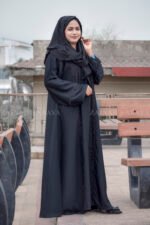 Black Maxi Abaya in Nida Korean Fabric featuring the strips and pearl work on front and sleeves as well as on scarf which is in chiffon fabric.