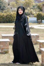 Black Front Open Abaya in Nida Korean Fabric featuring the leaf embroidery on sleeves and a matching scarf in chiffon.