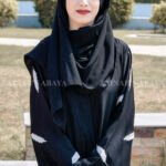 Black Front Open Abaya in Nida Korean Fabric featuring the leaf embroidery on sleeves and a matching scarf in chiffon.