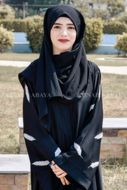 Black Front Open Abaya in Nida Korean Fabric featuring the leaf embroidery on sleeves and a matching scarf in chiffon.