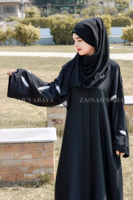 Black Front Open Abaya in Nida Korean Fabric featuring the leaf embroidery on sleeves and a matching scarf in chiffon.