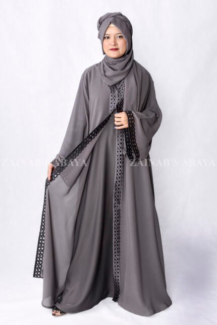 Grey Colored Gown Abaya in Nida Korean Fabric featuring embroidery and cutwork on front borders and sleeves as well as same matching scarf in chiffon.