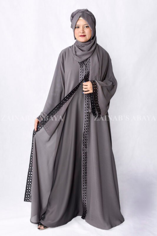 Grey Colored Gown Abaya in Nida Korean Fabric featuring embroidery and cutwork on front borders and sleeves as well as same matching scarf in chiffon.