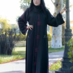 Black Front Open Abaya in Nida Fabric with Embroidery at front, sleeve and a matching scarf in chiffon fabric with same embroidery pattern.