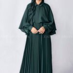 Nida Maxi Abaya with Shrug features elegant plates style at front, cuff style sleeves and a matching scarf in chiffon fabric.