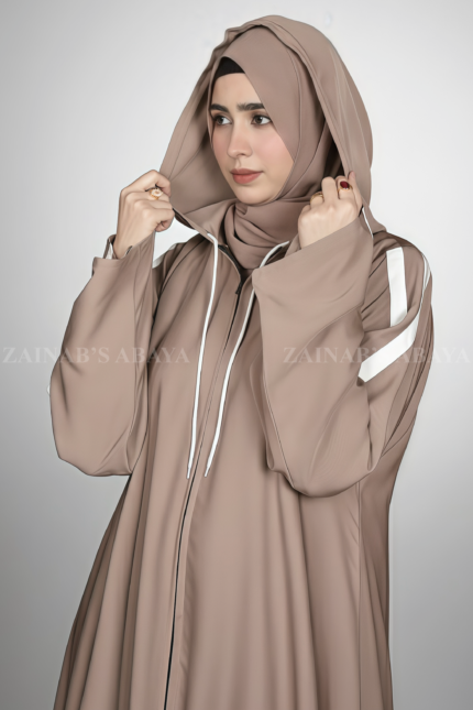 This Stylish Hoodie Abaya for women in Pakistan crafted with Premium Nida Korean Fabric and a matching scarf in chiffon fabric.