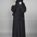 Black Coat Style Abaya for women in Nida Korean Fabric as well as matching scarf in chiffon fabric.