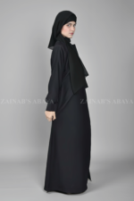 Black Coat Style Abaya for women in Nida Korean Fabric with a matching scarf in chiffon fabric.