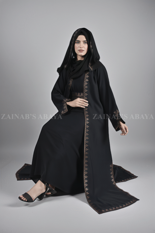 Black Maxi Abaya for women in Nida Fabric with Embroidered Top Chiffon an embroidered belt or a matching scarf in chiffon fabric.