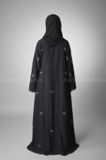 Black Maxi Abaya for women in Pakistan crafted with Premium Nida Korean Fabric featuring the bow style embroidery and stone work.