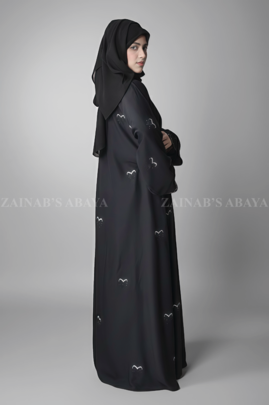 Black maxi abaya for women in Pakistan crafted with Premium Nida Korean Fabric featuring the stone embroidery work in bow style