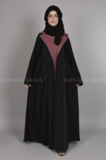 Nida Coat Style Abaya for women in Black Color with kasani colored attached inner and a matching scarf in chiffon fabric.