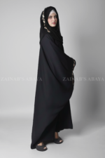 Black Kaftan Abaya for women is crafted with Premium Nida Korean Fabric featuring the embroidery and matching scarf in chiffon fabric.