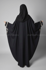 Black Kaftan Abaya for women is crafted with Premium Nida Korean Fabric featuring the embroidery on sleeves and matching scarf in chiffon fabric.