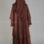 Nida Umbrella Abaya for women in Pakistan with open style from front and matching scarf in chiffon fabric.