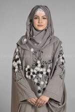 Nida Kaftan Abaya for women in Pakistan with Stone Detailing specifically designed for weddings and formal party wear. It comes with a matching scarf in chiffon fabric with same stone detailing.