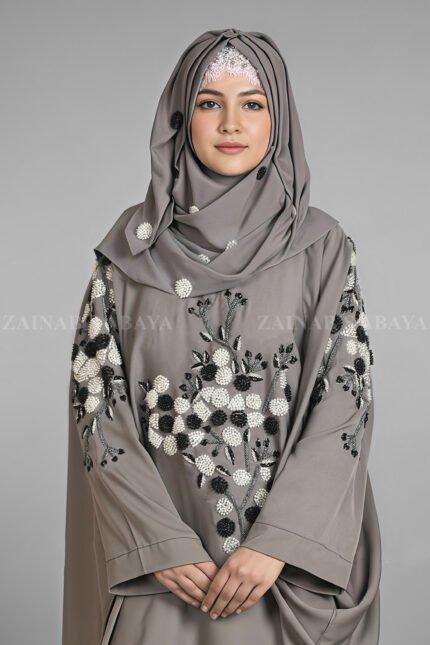 Nida Kaftan Abaya for women in Pakistan with Stone Detailing specifically designed for weddings and formal party wear. It comes with a matching scarf in chiffon fabric with same stone detailing.